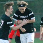 Blake Mason gets congratulated by teammates Dylan Ruth and Brian Yand after scoring in the 62nd minute of the match against Bellarmine Prep. It was the only goal of the game in the South Kitsap victory. (Mark Krulish/Kitsap News Group)