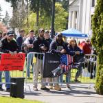 Attendees of the March for Our Rights rally hold up a flag that reads Liberty or Die, while another attendee holds a sign that says tyrants prefer unarmed subjects.  Photo by Emma Epperly, WNPA Olympia News Bureau