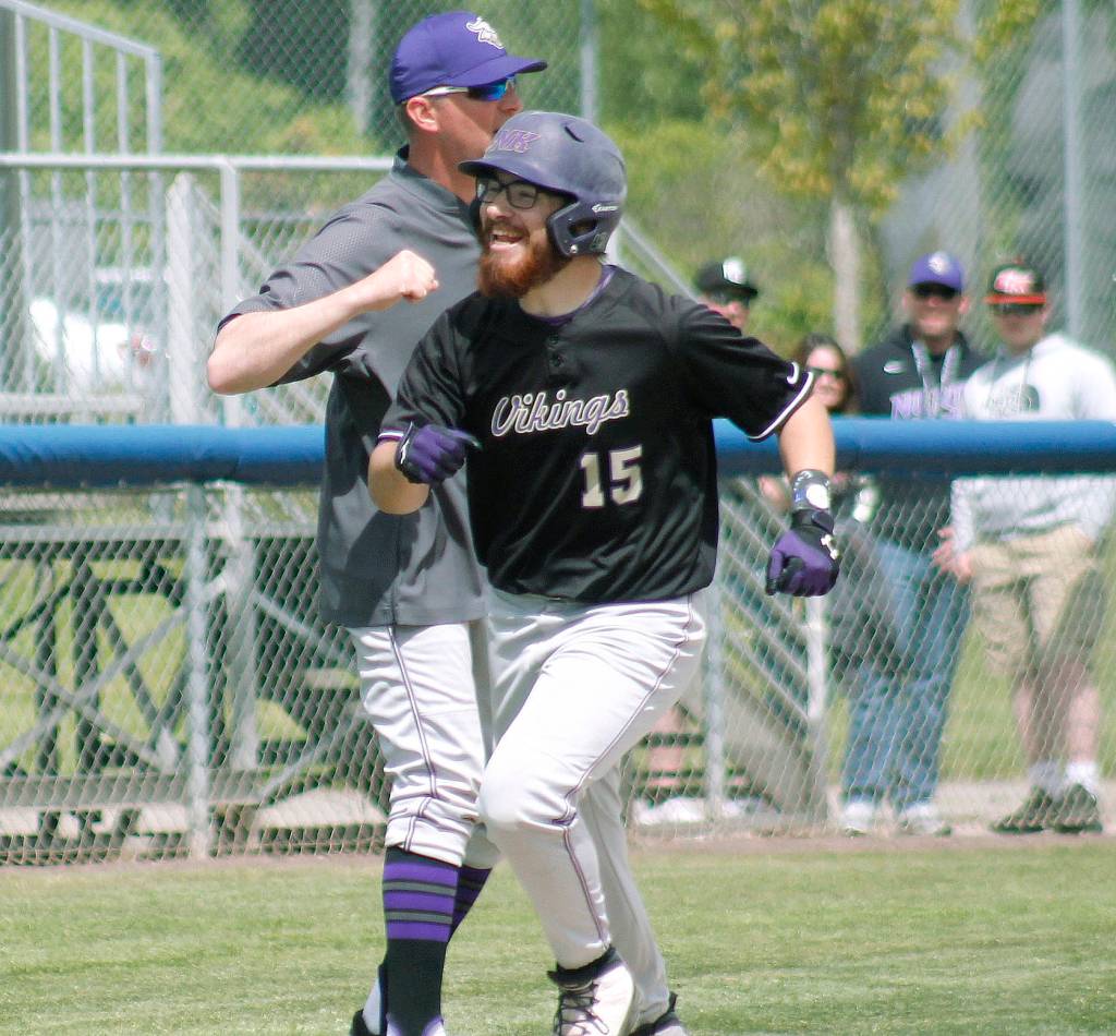 Tucker Gowin celebrates his three-run homer against Franklin Pierce. (Mark Krulish/Kitsap News Group)