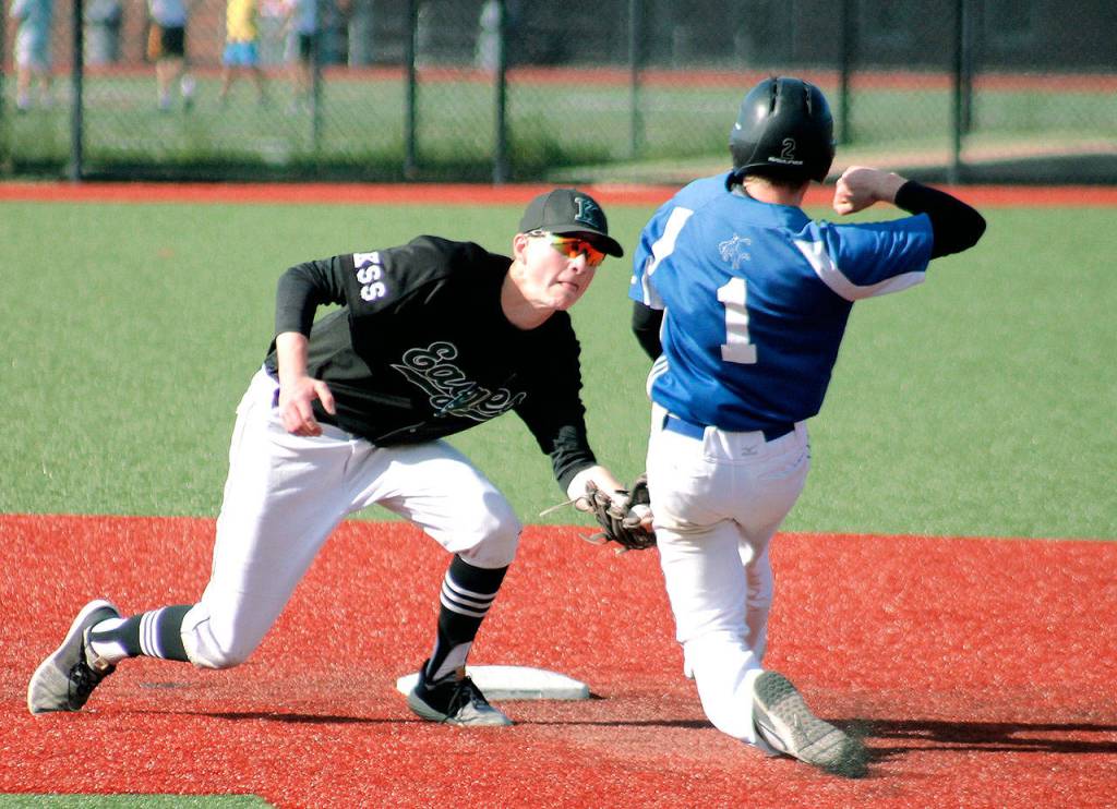 Logan Prater tags out Chimacums Isaac Purser in his attempt to steal second base. (Mark Krulish/Kitsap News Group)