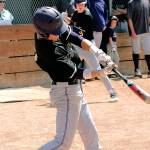 Isaac Richardson puts a ball in play against Sequim. (Mark Krulish/Kitsap News Group)