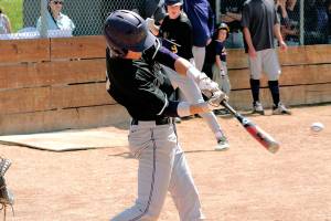 Isaac Richardson puts a ball in play against Sequim. (Mark Krulish/Kitsap News Group)