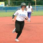 Olympics Sadie Chipley circles the bases after hitting one of her two home runs against North Kitsap in the district tournament third place game. (Mark Krulish/Kitsap News Group)