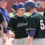 Max Larsen (7) and the rest of the Vikings congratulate Colton Bower on his home run against Sequim in the district playoffs. (Mark Krulish/Kitsap News Group)