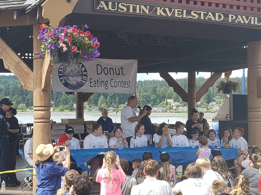 <em>Viking Fest features a doughnut eating contest hosted by Sluys Bakery as well as a lutefisk eating contest.</em>                                Tyler Shuey/Kitsap News Group