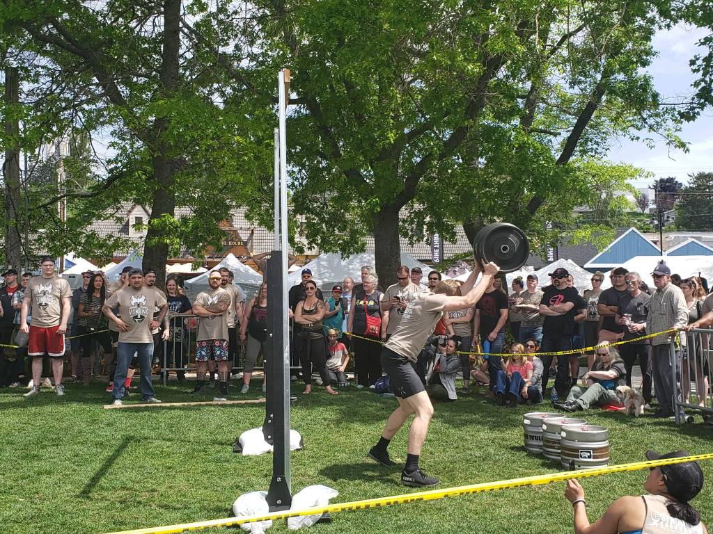 <em>Feats of strength are another staple of Viking Fest, contestants compete in the Strong Man Competition by hurling kegs over a post. </em>Tyler Shuey/Kitsap News Group<em></em>