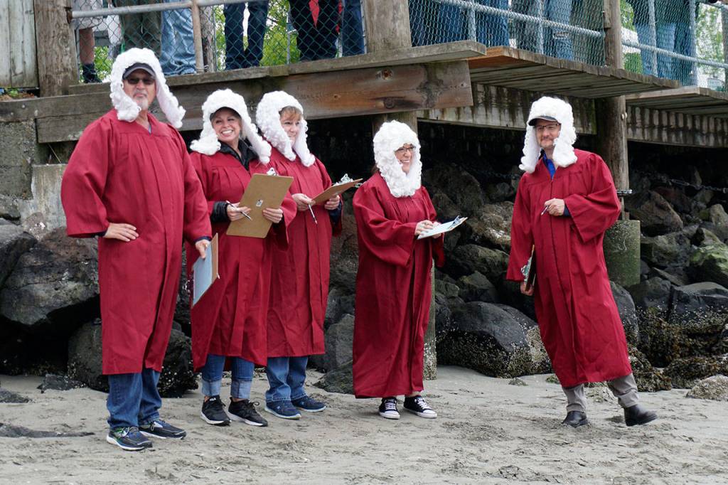 The judging panel assembles at the Port Orchard waterfront just before the start of the Seagull Calling Contest on Saturday. (Bob Smith | Kitsap Daily News)