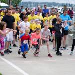 Kids kick into a run at the starting line of the Seagull Splat 5K Run/Walk on Saturday. (Bob Smith | Kitsap Daily News)