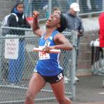 Tyishea McWhorter crosses the finish line in first place after running anchor on Bremertons state championship 4x100 relay team. (Mark Krulish/Kitsap News Group)