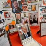 A collection of photographic memories, including congratulatory letters from President Trump and Gov. Inslee, are displayed at Stanley Hansens 100th birthday celebration. (Bob Smith | Kitsap Daily News)