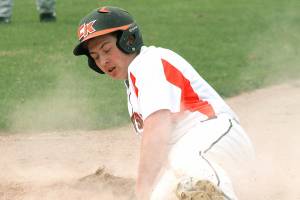 Central Kitsaps Carson Wiler slides into home plate to score one of the 30 runs tallied in the Senior All-Star game.