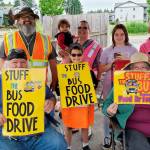 Stuff the Bus volunteers take a break at their grocery store collection station June 1. (SKSD photo)