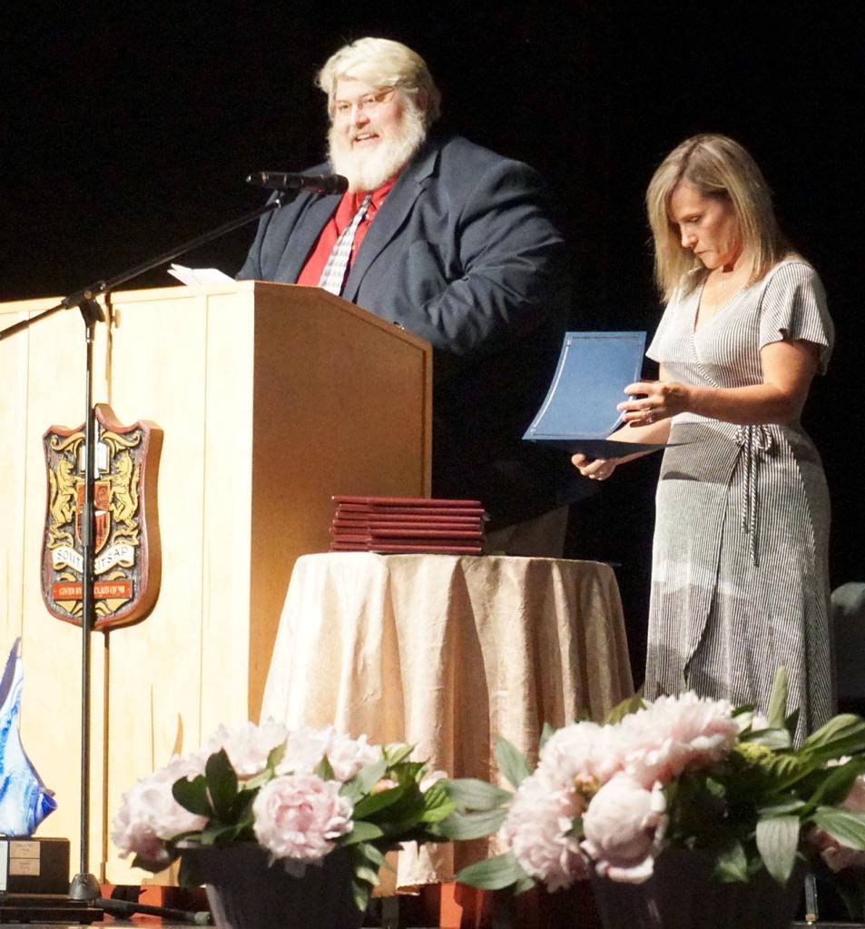 South Kitsap Alternative Programs Principal Pat Oster speaks to the audience attending Explorer Academys graduation ceremony just prior to handing out diplomas to graduating seniors. (Bob Smith | Kitsap Daily News)