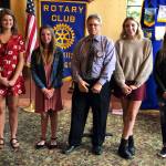 President David Jones (third from left) joins with South Kitsap High School scholarship winners Emmeline Hutchinson (far left), Paige Ohman, Emma Ericson and Katie Hickle. (Rotary Club of South Kitsap photo)