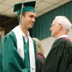 Graduates get their diploma and proceed out. (Mark Krulish/Kitsap News Group)