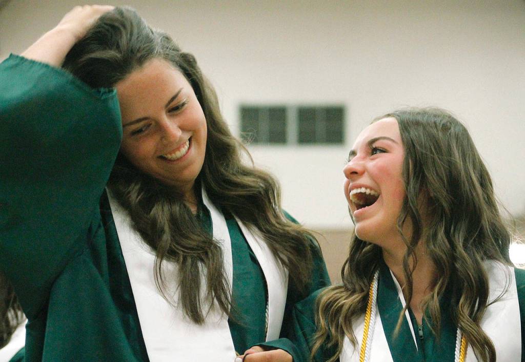 Graduates get their diploma and proceed out. (Mark Krulish/Kitsap News Group)