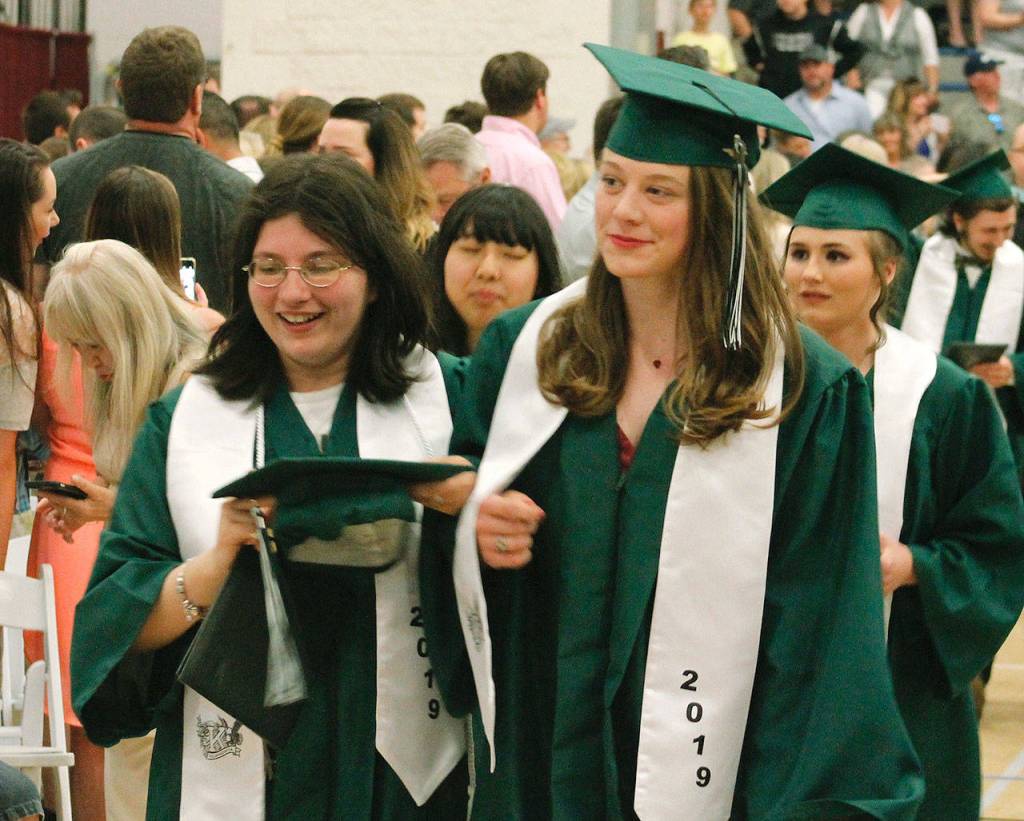 Graduates get their diploma and proceed out. (Mark Krulish/Kitsap News Group)