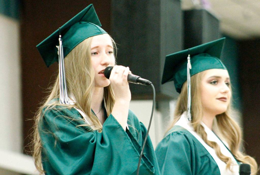 Brooklyn Neshem and Zoe Stevens sing For Good from the Broadway musical Wicked during the ceremony. (Mark Krulish/Kitsap News Group)
