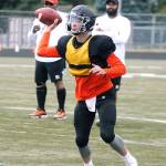 Central Kitsaps Joshua Flaugher throws on the run against North Kitsap. (Mark Krulish/Kitsap News Group)