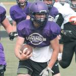 Cache Holmes carries the ball for North Kitsap at a recent scrimmage against Central Kitsap. (Mark Krulish/Kitsap News Group)