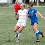 Oly-Pen Forces Saoirse Brown of Olympic battles for a loose ball. (Mark Krulish/Kitsap News Group)