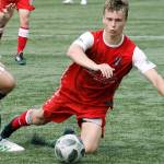 Mitchell Balmer gets taken down going for a loose ball against Spokane Shadow. (Mark Krulish/Kitsap News Group)