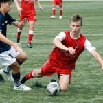 Mitchell Balmer gets taken down going for a loose ball against Spokane Shadow. (Mark Krulish/Kitsap News Group)