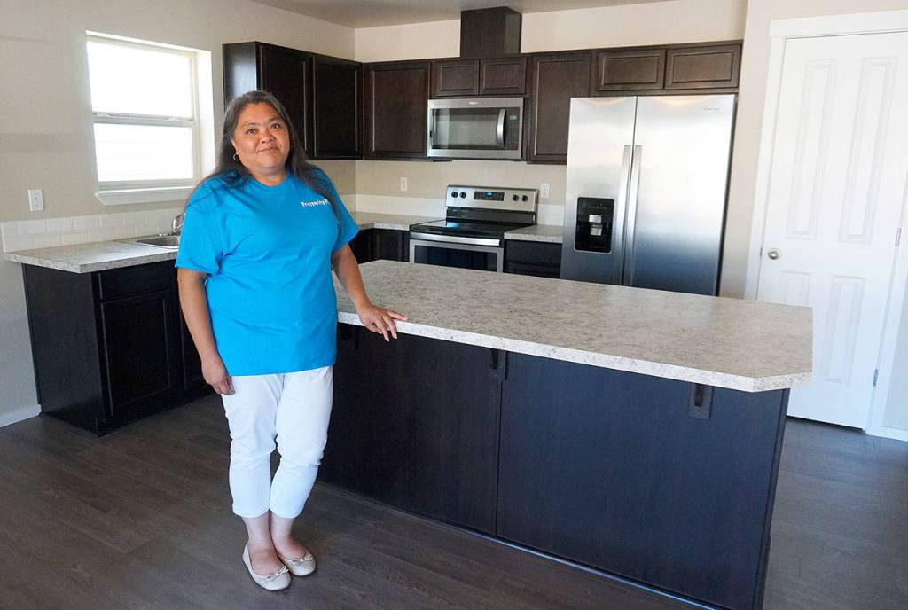 New owners at Prosperity Place hammer their way to a new life