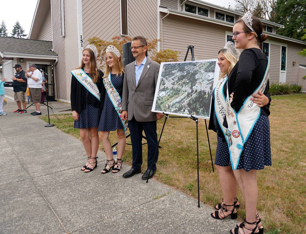 Mayor Rob Putaansuu poses with members of the Fathoms O Fun Royalty Court at the Tremont Street completion project ceremony on Friday at Bethany Lutheran Church in Port Orchard. (Bob Smith | Kitsap Daily News)