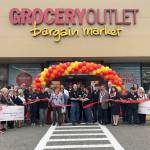 Greg Bovan and Deeann Haberly-Bovan cut the ribbon to signify the opening of Port Orchards new Grocery Outlet Bargain Market store. Joining the owner-operators are Mayor Rob Putaansuu and state Rep. Michelle Caldier of the 26th Legislative District. (Courtesy photo)