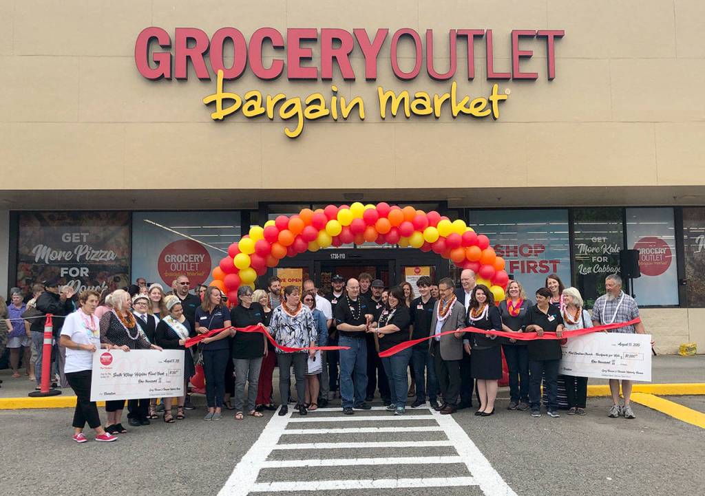 Greg Bovan and Deeann Haberly-Bovan cut the ribbon to signify the opening of Port Orchards new Grocery Outlet Bargain Market store. Joining the owner-operators are Mayor Rob Putaansuu and state Rep. Michelle Caldier of the 26th Legislative District. (Courtesy photo)