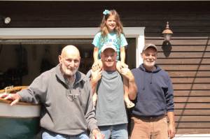 <em>Paul Diehl, Matt and Shelby Diehl and Eric Diehl stand beside their Poulsbo Boat. </em>Nick Twietmeyer/ Kitsap News Group
