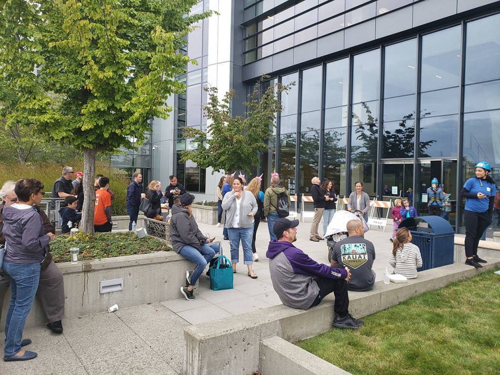 Elected officials, volunteers rappel down Norm Dicks Government Center for charity