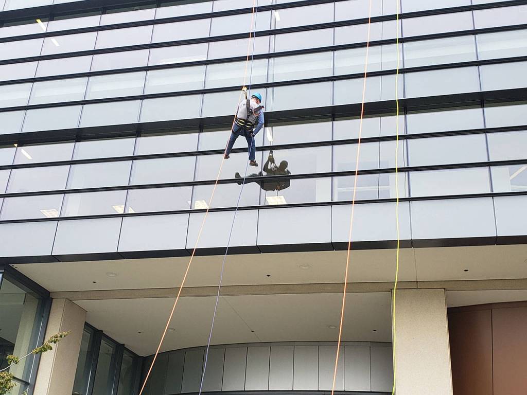 Elected officials, volunteers rappel down Norm Dicks Government Center for charity