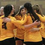 The Buccaneers huddle up during a timeout late in set three just before defeating Bainbridge in their opening match. (Mark Krulish/Kitsap News Group)