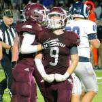 South Kitsap senior Tyson Carter celebrates after a tackle for a loss against Rogers. (Mark Krulish/Kitsap News Group)