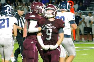 South Kitsap senior Tyson Carter celebrates after a tackle for a loss against Rogers. (Mark Krulish/Kitsap News Group)
