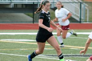 Hope Martin dribbles through the South Kitsap defense during a recent non-league match. (Mark Krulish/Kitsap News Group)