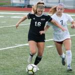 Klahowya freshman Tori Peters (16) holds off South Kitsaps Lily Lutovsky. (Mark Krulish/Kitsap News Group)