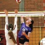 Riley Rabedeaux knocks down one of her 14 kills against South Kitsap. (Mark Krulish/Kitsap News Group)