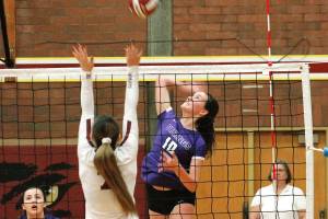 Riley Rabedeaux knocks down one of her 14 kills against South Kitsap. (Mark Krulish/Kitsap News Group)