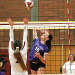 Riley Rabedeaux knocks down one of her 14 kills against South Kitsap. (Mark Krulish/Kitsap News Group)