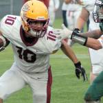 Kingstons Kyler Coe-Yarr, left, fends off the defense of Port Angeles Tyler Bowen on Friday night at Port Angeles Civic Field. (Keith Thorpe/Peninsula Daily News)