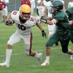 Kingstons Kyler Coe-Yarr, left, fends off the defense of Port Angeles Tyler Bowen on Friday night at Port Angeles Civic Field. (Keith Thorpe/Peninsula Daily News)