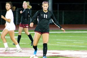 South Kitsaps Franqie Moppins sends a pass towards her winger against Graham-Kapowsin. (Mark Krulish/Kitsap News Group)