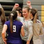 Maddie Pryde (12) celebrates a victory over Bremerton with Autumn Carver (9) and Emma Orness (4). (Mark Krulish/Kitsap News Group)
