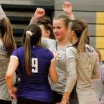 Maddie Pryde (12) celebrates a victory over Bremerton with Autumn Carver (9) and Emma Orness (4). (Mark Krulish/Kitsap News Group)