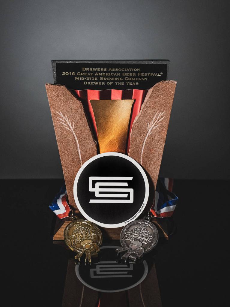 <em>Silver City Brewery showing off the hardware. </em>                                Photo courtesy of Silver City