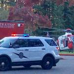 Responders from the Washington State Patrol, North Kitsap Fire & Rescue and Airlift Northwest at David Wolfle Elementary work to transport a motorcyclist to Harborview Medical Center. Photo Courtesy Holly Lawrence.