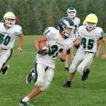 Klahowyas Max Garvey carries the ball during a recent practice. (Mark Krulish/Kitsap News Group)